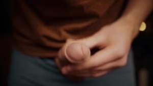 boy with a big dick playing with his foreskin in 4K