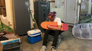 Putting riser pads on my roommates skateboard in my garage