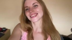 Pretty girl shows off her pink nightie.